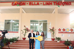 Representatives of Canon Funds handed key symbol to school