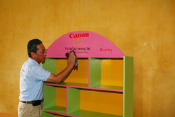 Factory Manager arranges the Canon bookshelf