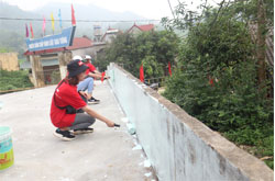 Volunteers & local union members level the ground & painting at school area